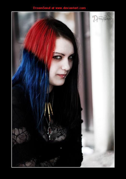 A picture of a gothic girl with red, blue and black hair taken at the Peace 